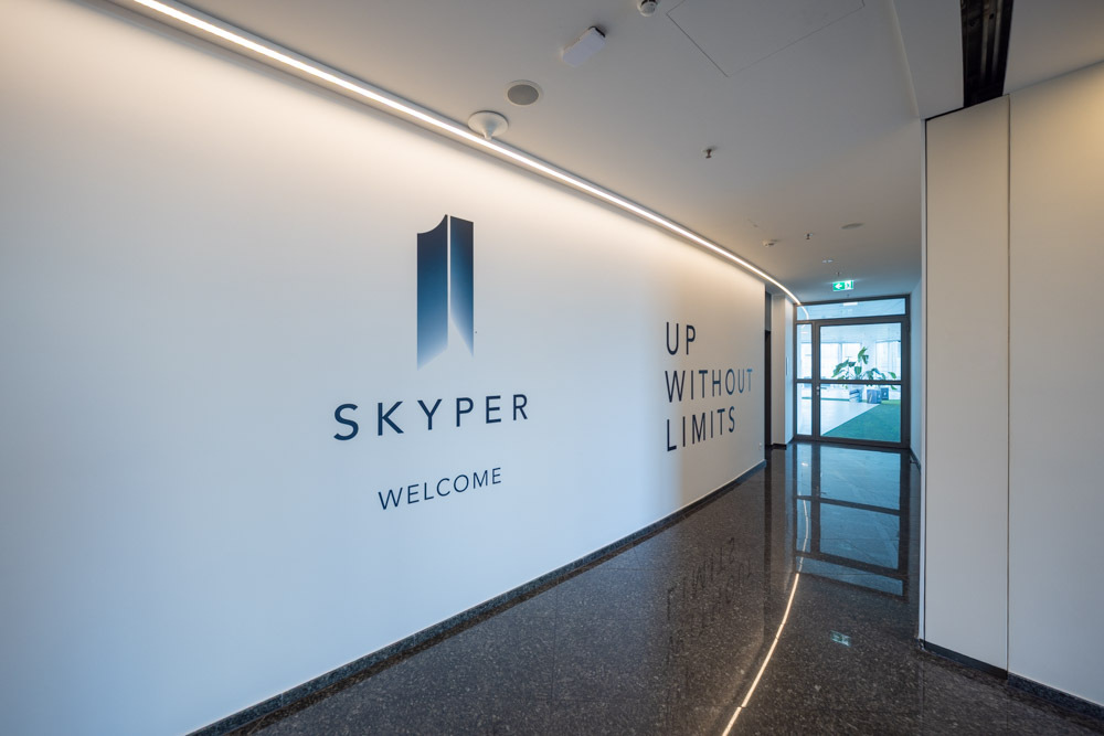 modern corridor, high-quality stone flooring and access to the office spaces.